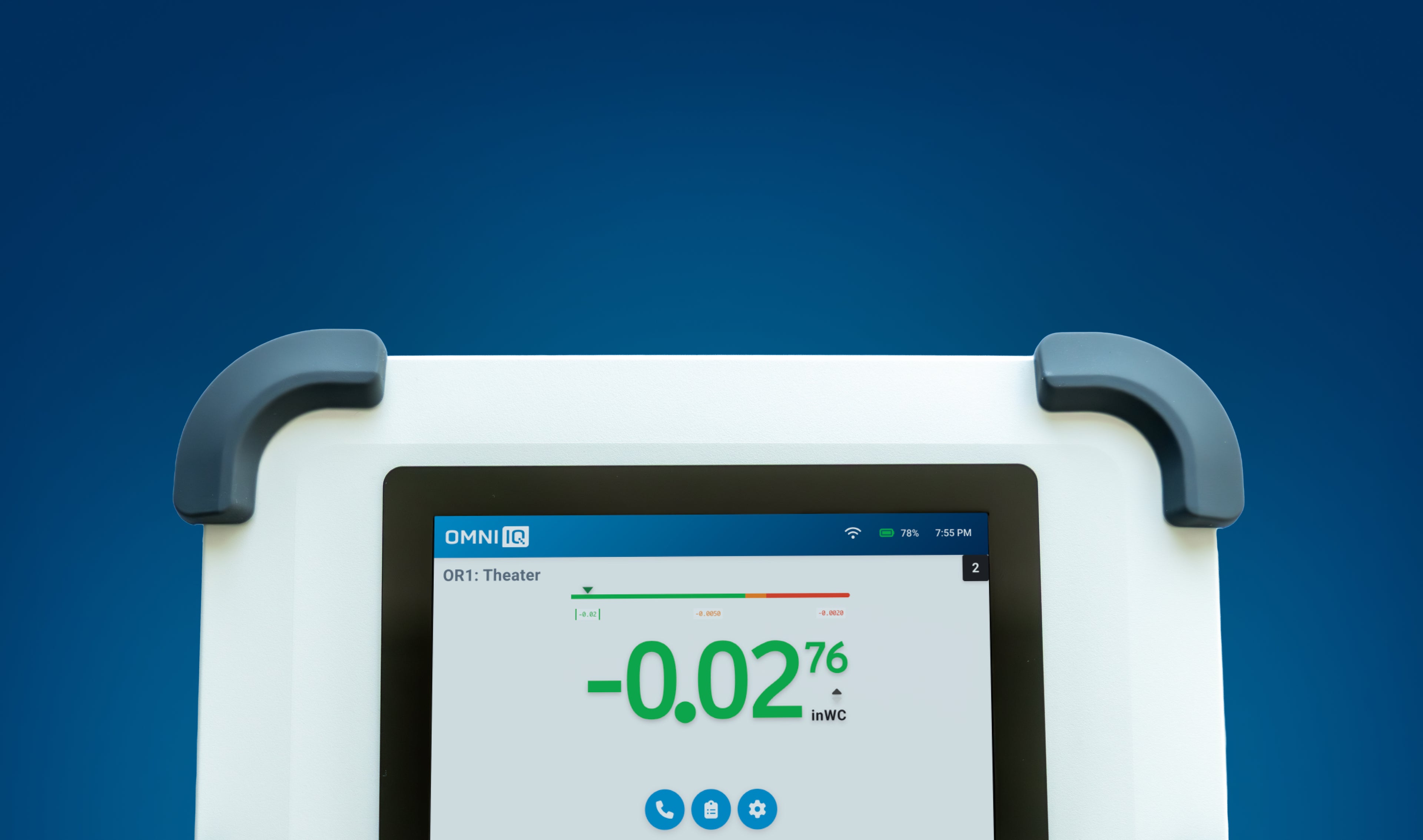 Omni IQ Differential Pressure Monitor digital screen up close showing pressure readings in a containment environment.